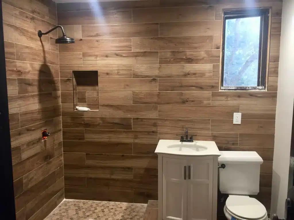 Modern Bathroom Remodel with Wood-like tiles- Ground Up Builders