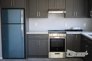 Modern Kitchen with Gray Cabinets- Ground Up Builders