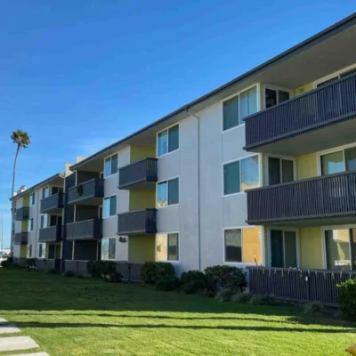 Modern Multifamily Building with Black Railings- Ground Up Builders