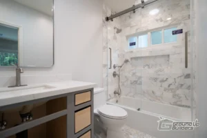 Stylish Bathroom with Tub & Marble Shower- Ground Up Builders