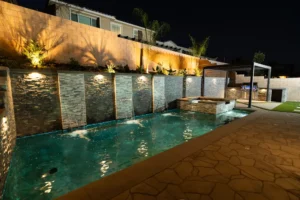 Backyard Pool with Waterfalls and Pergola in Fontana, CA | Ground Up Builders