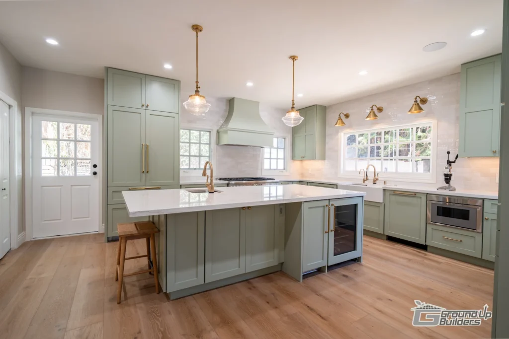 Wide-Angle Kitchen View with Center Island and Brass Accents | Ground Up Builders