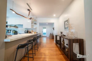 Open Living Area Renovation with Breakfast Bar | Ground Up Builders