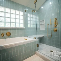 Elegant Bathroom with Blue Tiles- Ground Up Builders