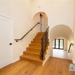Elegant Staircase with Wooden Steps- Ground Up Builders