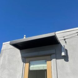 overhang over door- Ground Up Builders