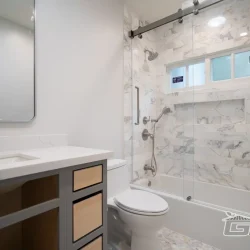 Stylish Bathroom with Tub & Marble Shower- Ground Up Builders