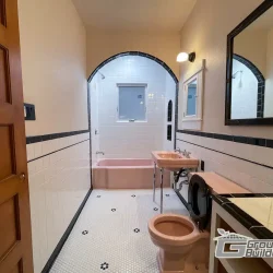 Vintage Bathroom with Pink Fixture- Ground Up Builders